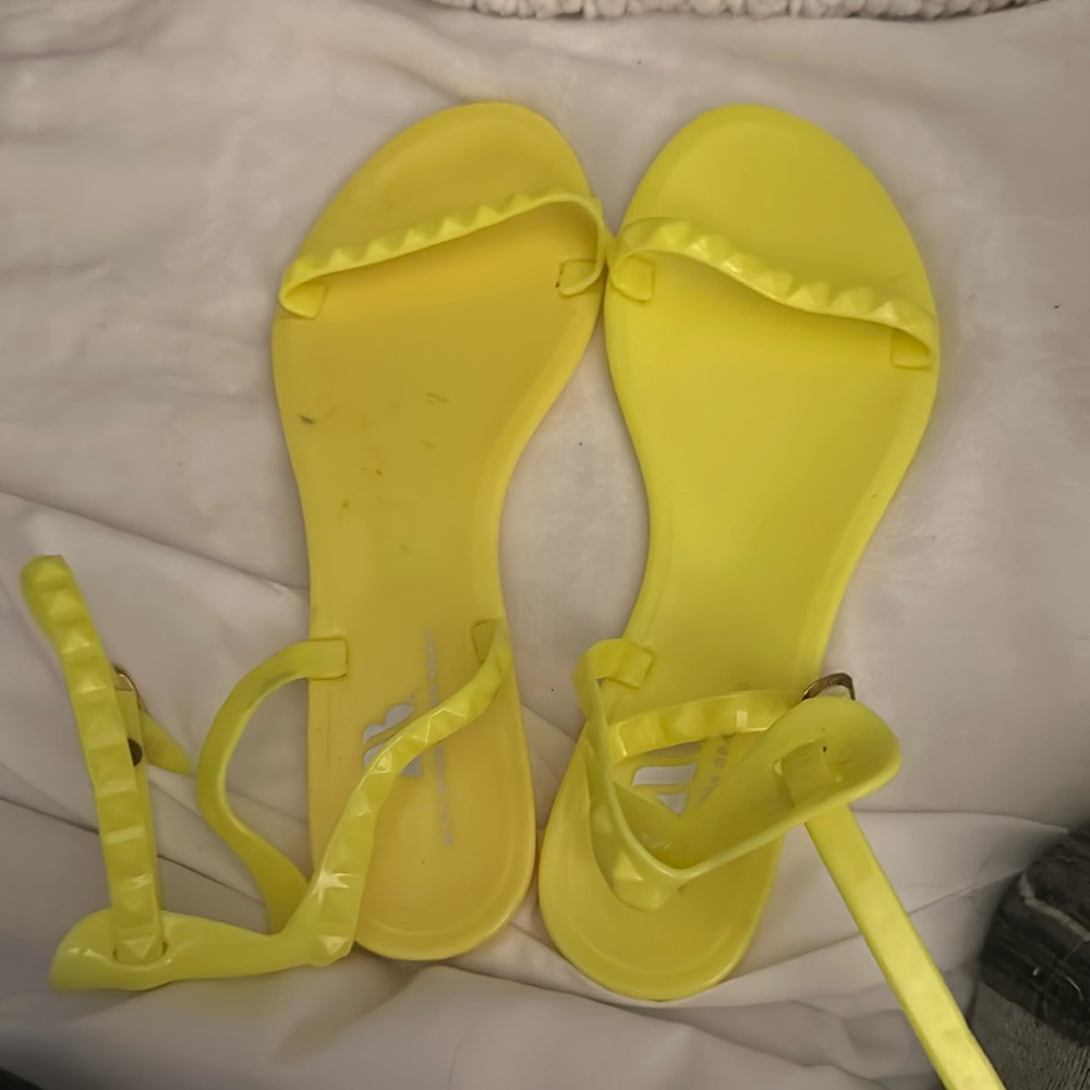Sandals neon green have a spot in the shoe but never been used size 7